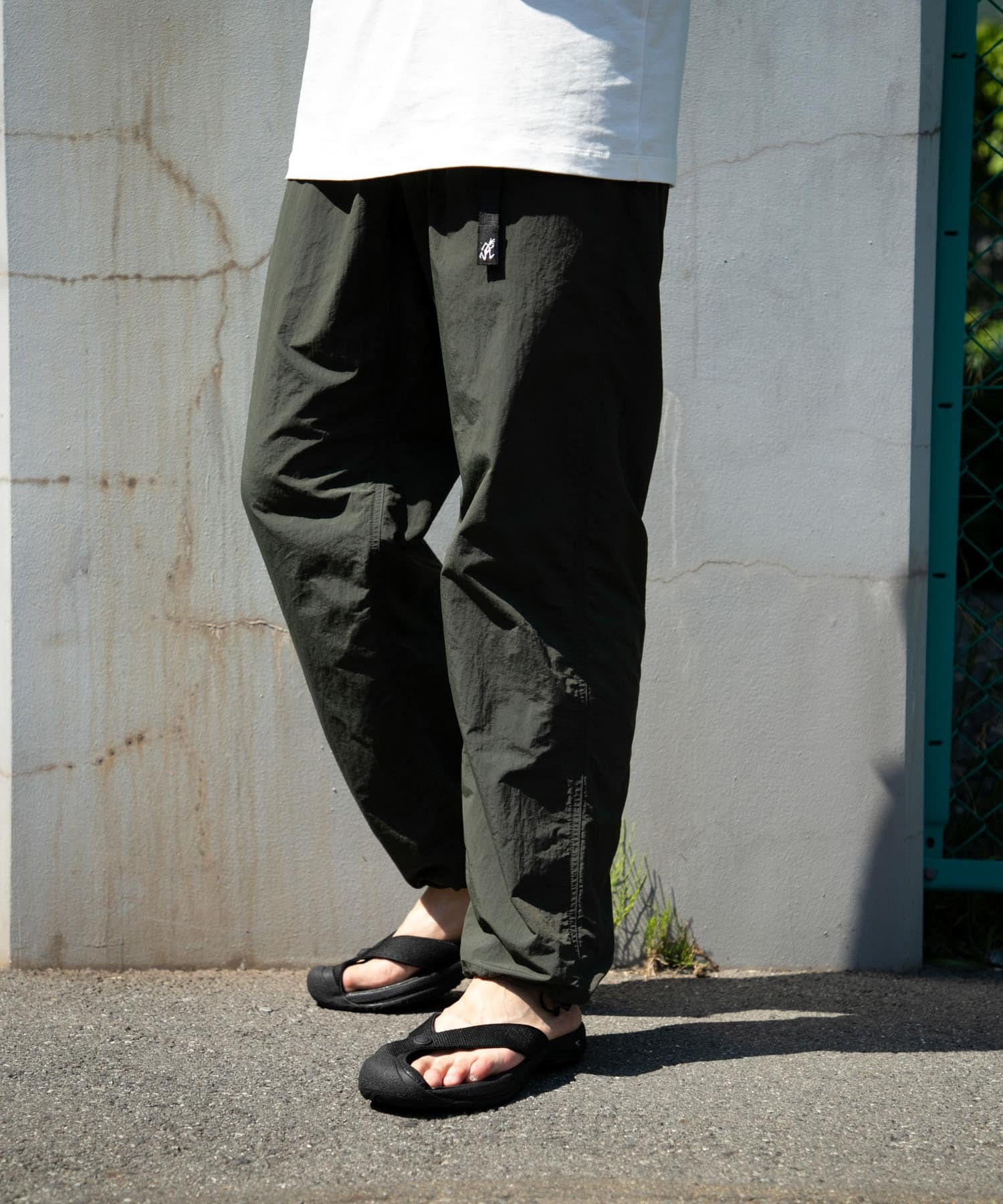 大人気商品 LOWERCASE / GRAMICCI NYLON TRACK PANTS